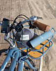 Front view of Bluejay e-bike with accessories in front rack.