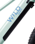 Close-up of Bluejay WILD logo on Mint Green kids' e-bike
