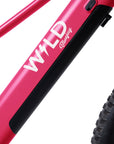 Logo close-up of Bluejay WILD kids' e-bike in Hot Pink.