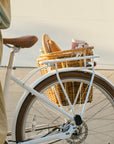 Rear view of a Bluejay e-bike in Modern White with a Pannier Nantucket basket