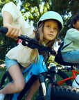 Close-up of children riding Bluejay WILD electric bikes e-bikes
