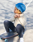 Kid wearing Thousand Jr. Helmet in blue