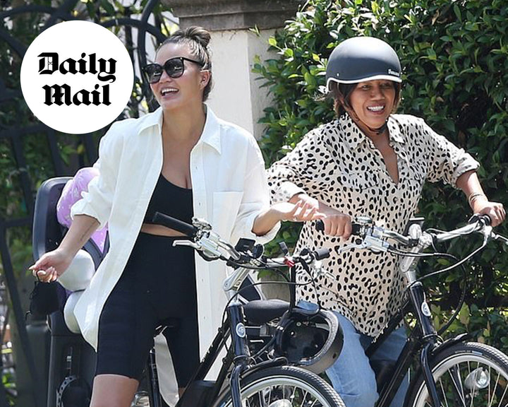 Chrissy Teigen bursts out in laughter while enjoying a bike ride with her mom and daughter Luna