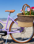 Bluejay Premiere Edition e-bike in French Lavender with Bolga basket of flowers