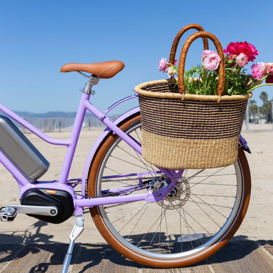 Bluejay Premiere Edition e-bike in French Lavender with Bolga basket of flowers