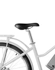 Close-up view of rear wheel and black seat of Bluejay e-bike 