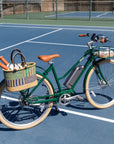 Bluejay Premiere Edition e-bike in British Racing Green on tennis court 