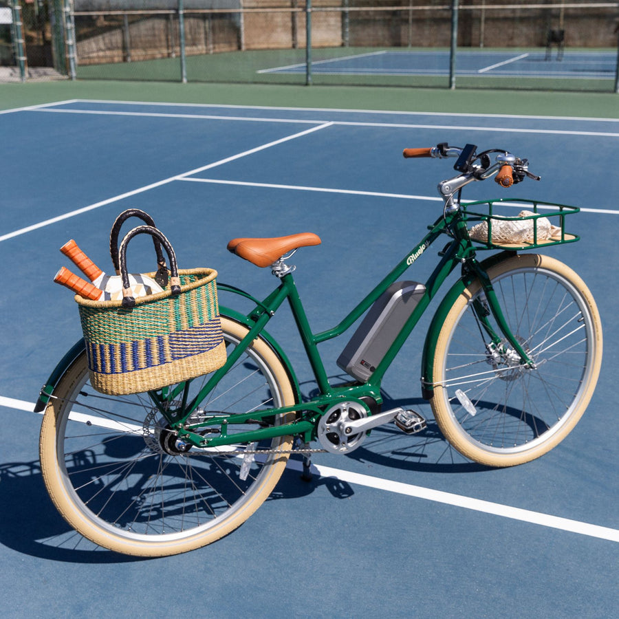 Bluejay Premiere Edition e-bike in British Racing Green on tennis court 