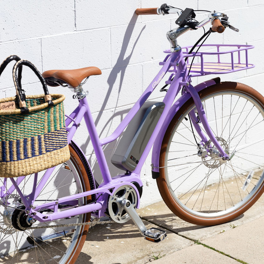 Bluejay Premiere Edition e-bike in French Lavender with rear Bolga basket 