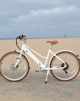 Bluejay Premiere Edition e-Bike in Modern White at the beach 