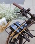 Close-up of Bluejay e-bike handlebars, basket with wine and flowers