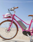 Bluejay Premiere Edition e-bike in Hot Pink with white helmet 