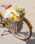 Bluejay Premiere Edition e-bike in Golden Yellow with rear Nantucket basket