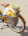 Bluejay Premiere Edition e-bike in Golden Yellow with rear Nantucket basket