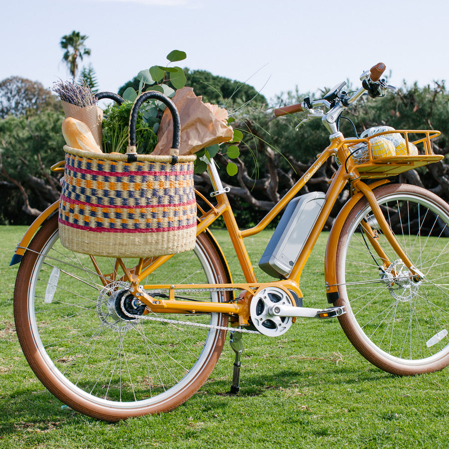 Bluejay Premiere Edition e-bike in Golden Yellow with Bolga basket 