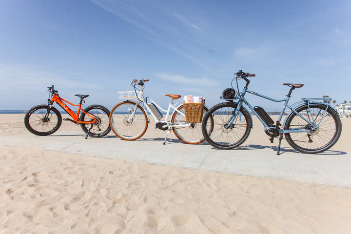 Three Bluejay bicycles at the beach on a sunny day. 