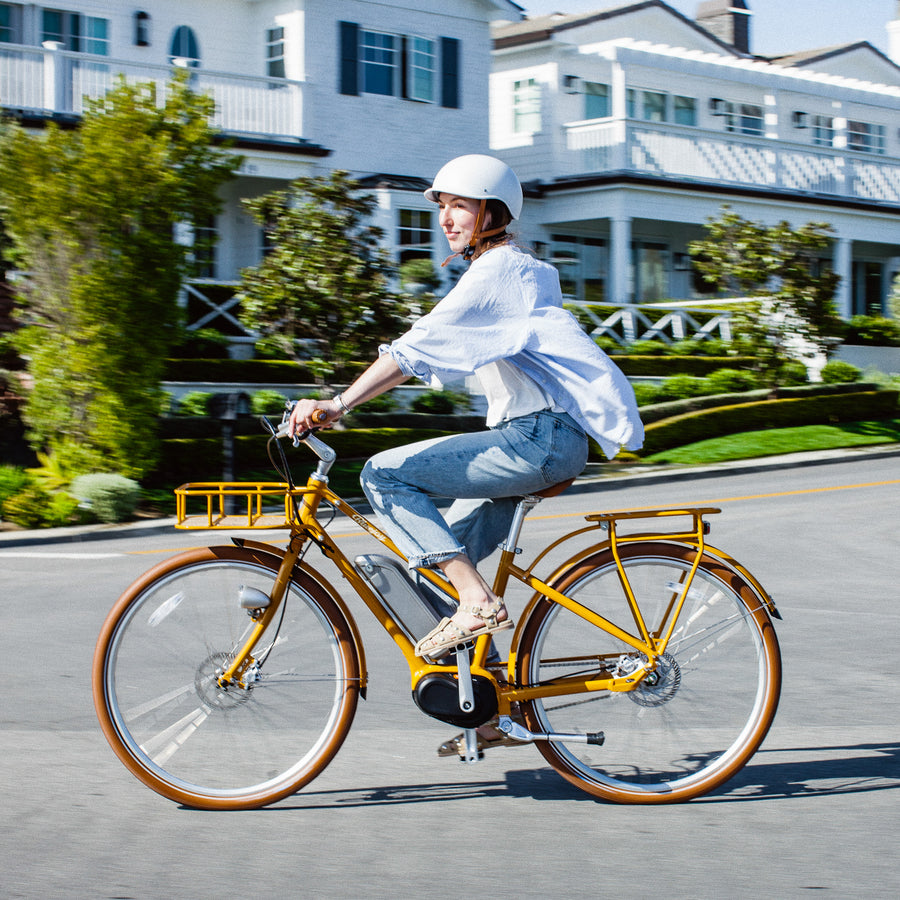 Bluejay Premiere Edition electric bike Golden Yellow e-bike woman riding